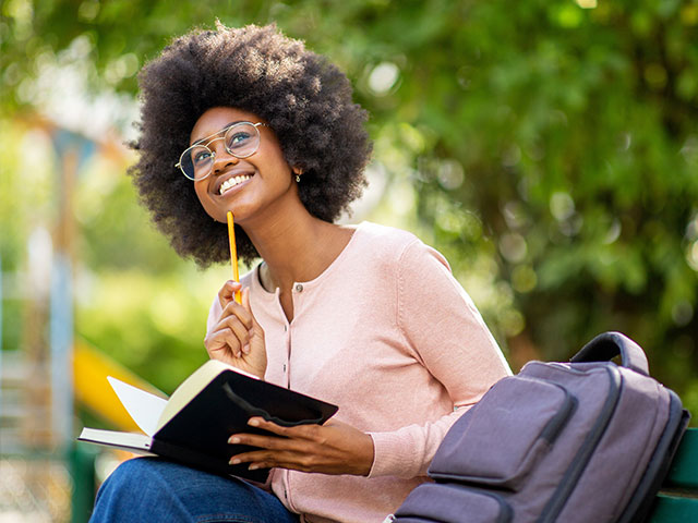 Student holding a pencil