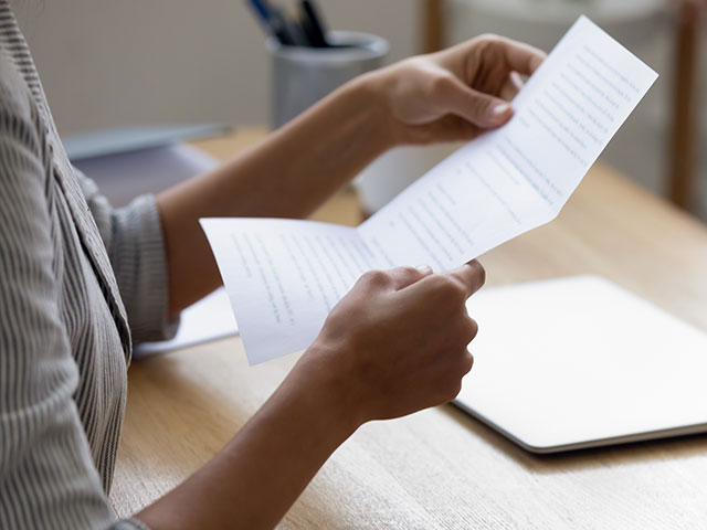 Person holding letter