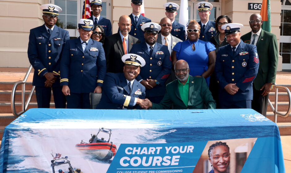 President Robinson and USCG Rear Admiral Will E. Watson celebrate the signing of a partnership agreement on Veterans’ Day.