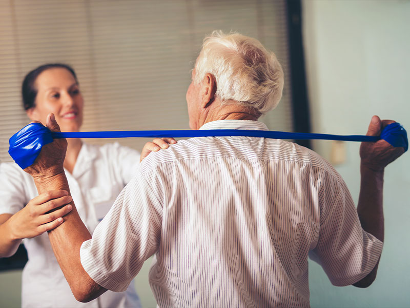 Older man doing occupational therapy