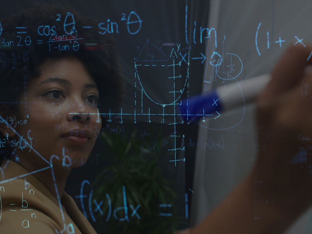 university student writing on whiteboard