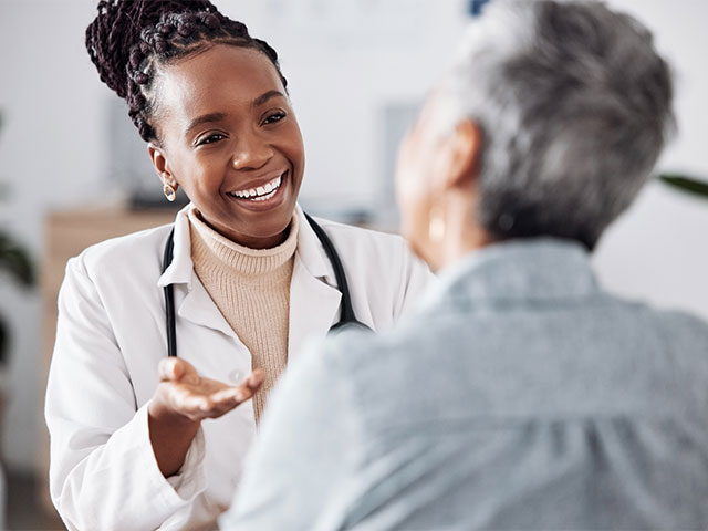 Nurse assisting elderly patients at an assisted living facility