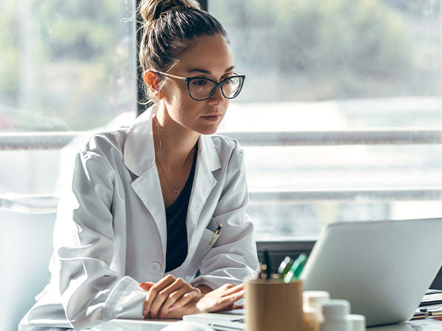 Nurse looking at computer