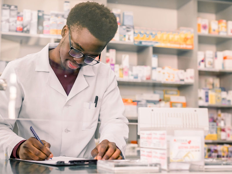 Pharmacy student reviewing clipboard