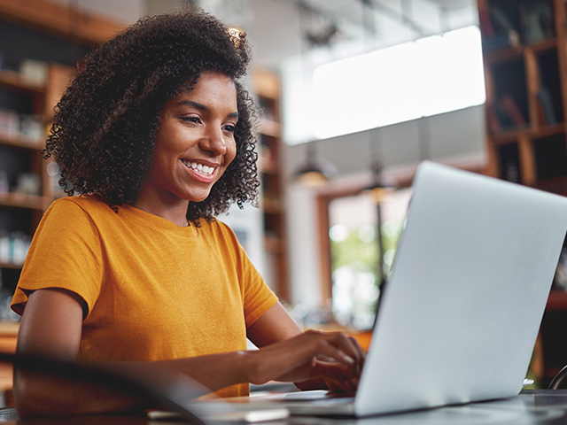 young african american woman using a laptop