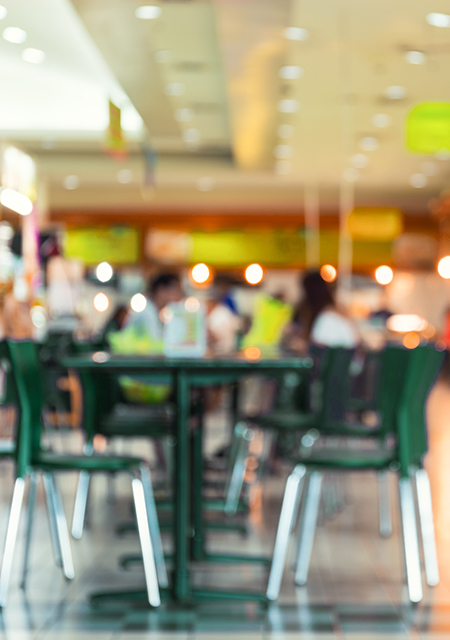 Defocused or blurred photo of a food court