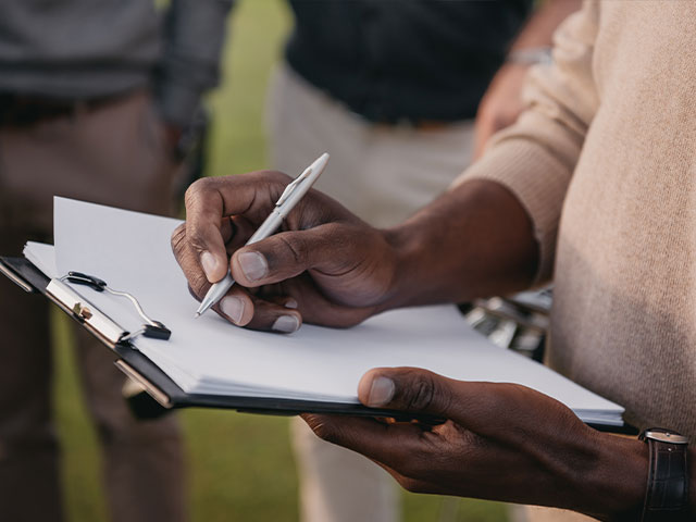 Person holding checklist