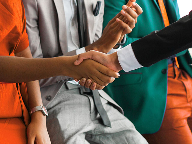 Committee members shaking hands