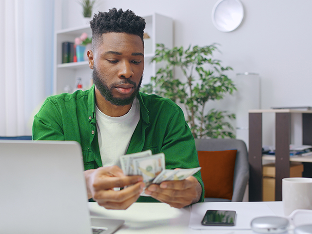 Young man counting money