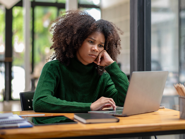 upset student using laptop