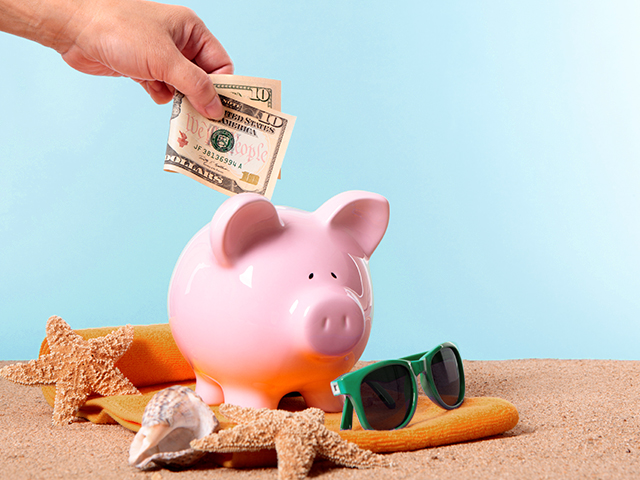 piggy bank on beach 
