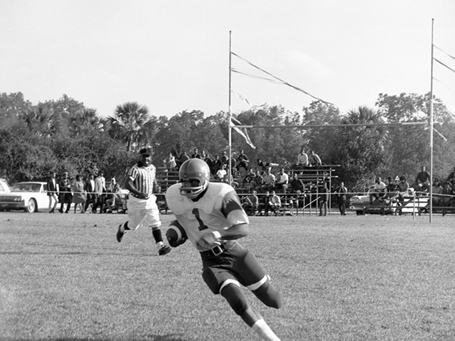 Float in the FAMU homecoming parade. The Sign at front of car reads, "Miss Pre-Med. 1965-66"