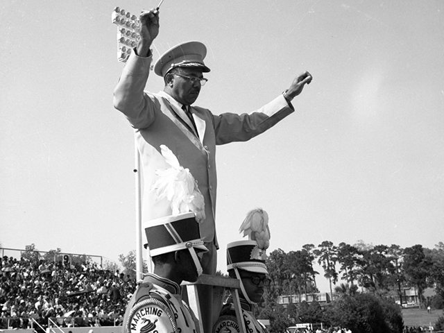 (1967) FAMU band director William P. Foster at Bragg Memorial Stadium during homecoming football game in Tallahassee.