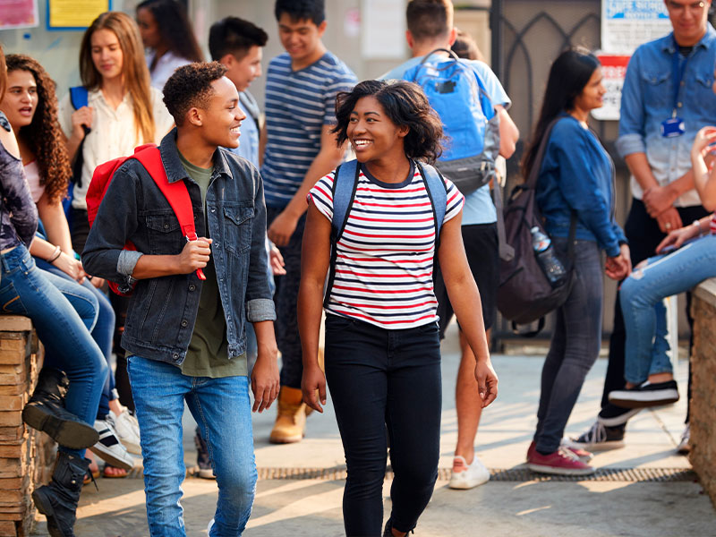 Students walking to class laughing